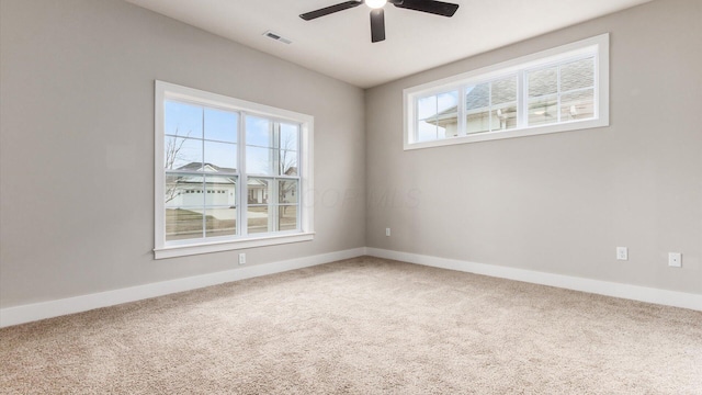 unfurnished room with ceiling fan and carpet flooring