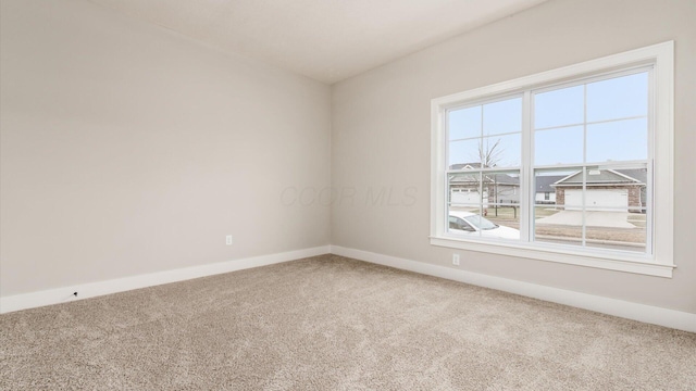 unfurnished room with carpet floors