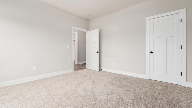 unfurnished bedroom with carpet floors