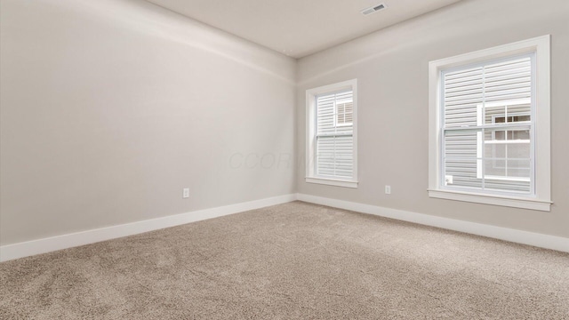 unfurnished room with carpet floors