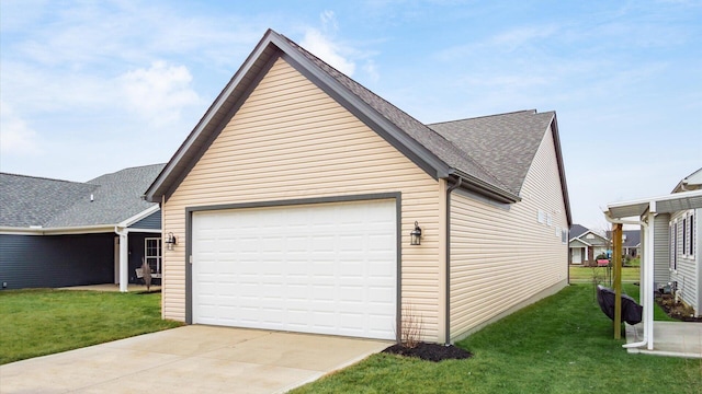 view of side of home with a yard and a garage