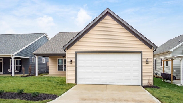 view of front of home with a garage and a front yard