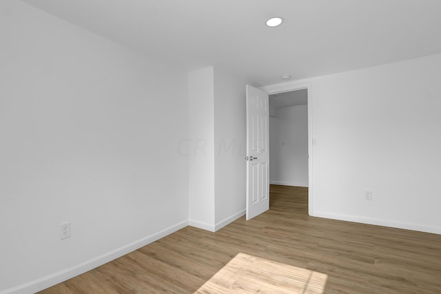 unfurnished room featuring light hardwood / wood-style floors