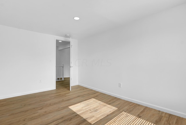 spare room featuring hardwood / wood-style floors