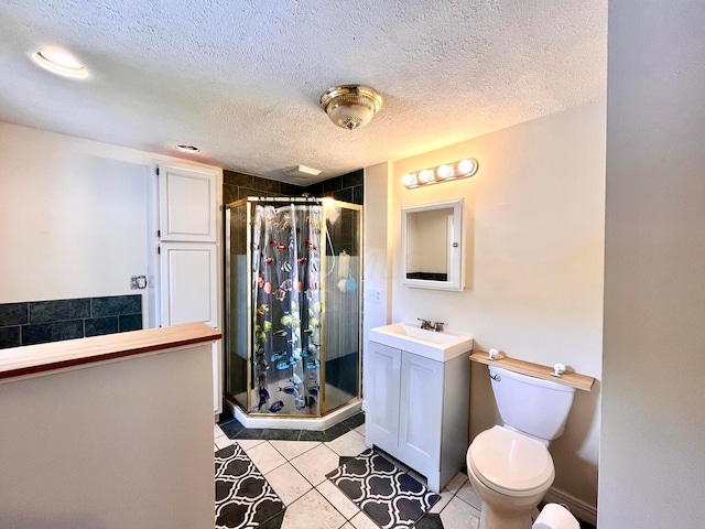 bathroom featuring tile patterned floors, a textured ceiling, toilet, a shower with door, and vanity