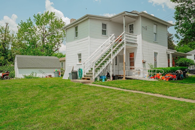 rear view of house with a lawn