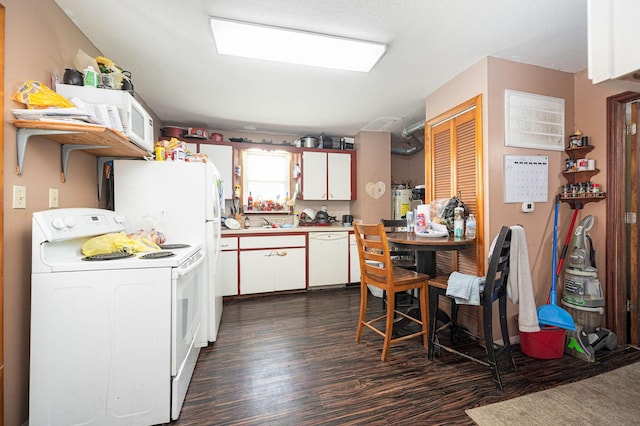 kitchen featuring white cabinets, white appliances, and dark hardwood / wood-style floors