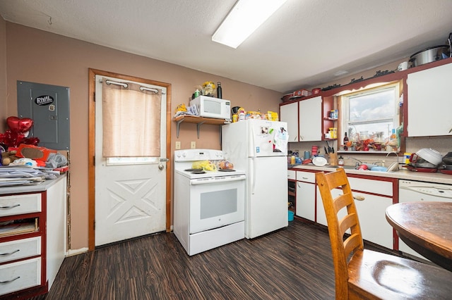 kitchen with white appliances, dark wood-type flooring, electric panel, sink, and white cabinetry