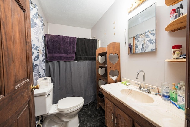 bathroom featuring a textured ceiling, vanity, toilet, and a shower with curtain