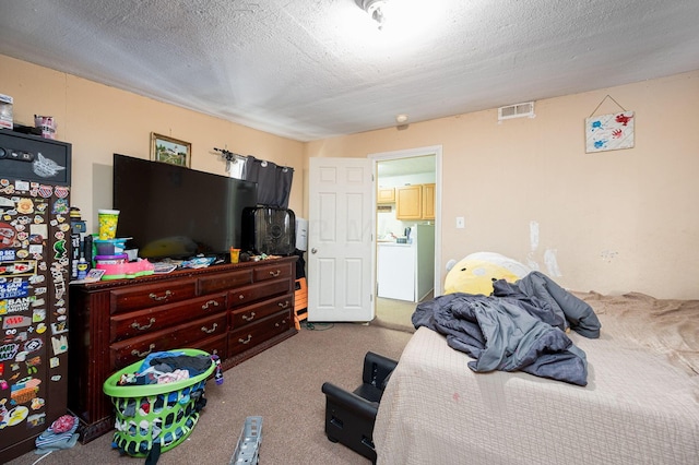 bedroom with carpet and a textured ceiling