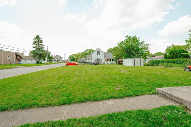 view of yard with a storage unit