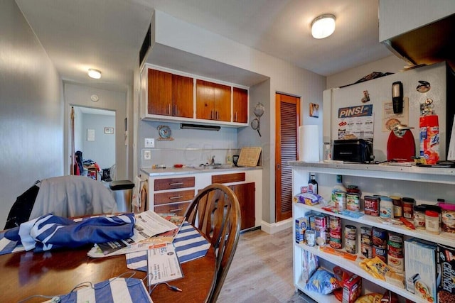 kitchen with light wood-type flooring