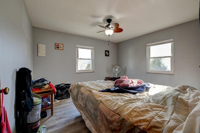 bedroom featuring hardwood / wood-style floors and ceiling fan