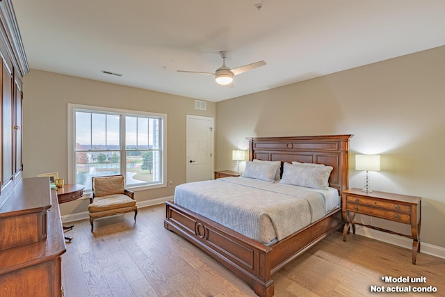 bedroom featuring light wood-type flooring and ceiling fan