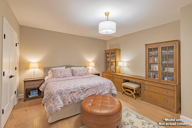 bedroom with light hardwood / wood-style floors