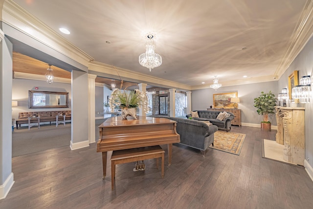 living room with ornate columns, dark hardwood / wood-style flooring, a notable chandelier, and ornamental molding