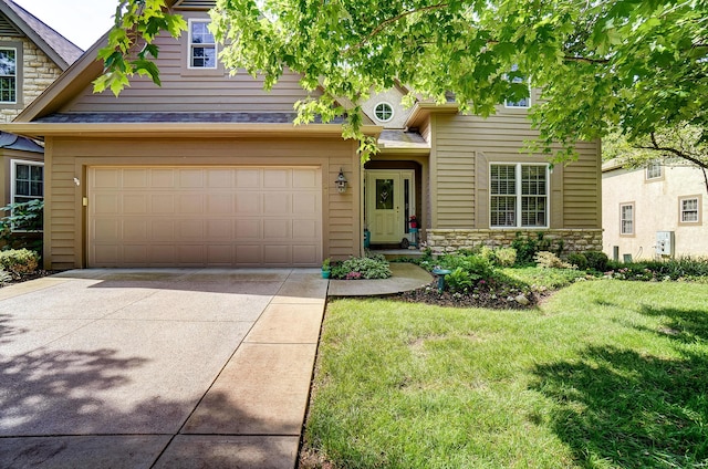 view of front of property featuring a garage and a front yard