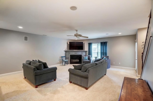 living room featuring light carpet and ceiling fan