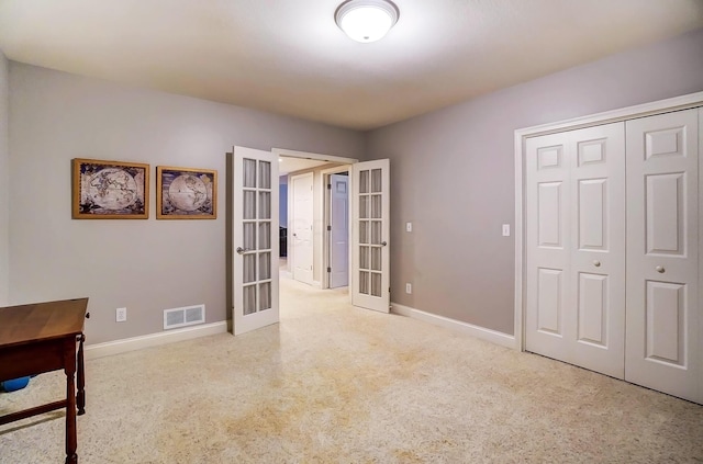 interior space featuring french doors and a closet