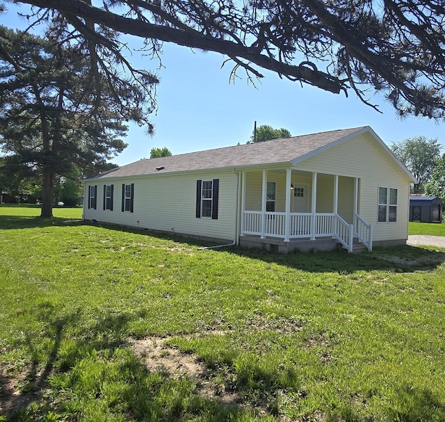 view of front of home featuring a front yard and a porch