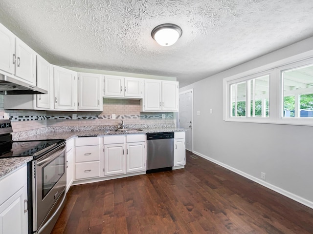 kitchen featuring white cabinetry, sink, stainless steel appliances, and dark hardwood / wood-style floors