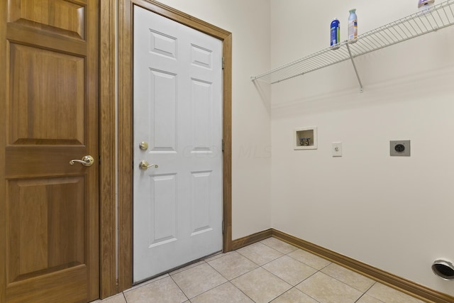 washroom featuring electric dryer hookup, light tile patterned floors, and hookup for a washing machine