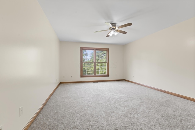 empty room featuring carpet and ceiling fan