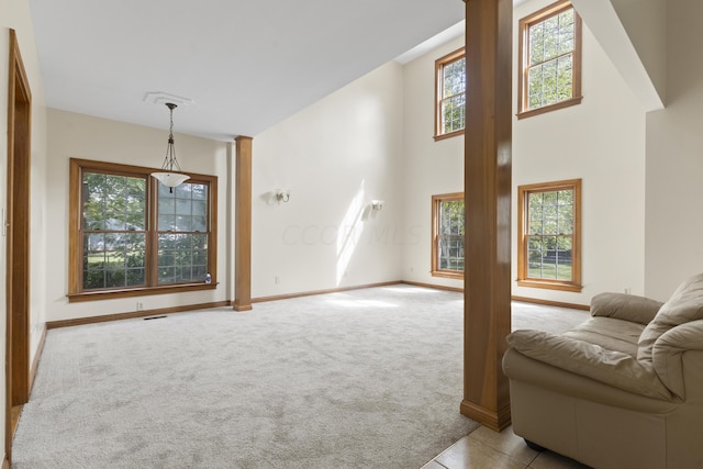 living room featuring plenty of natural light and light carpet