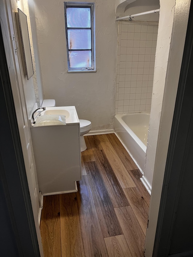 1001 Lilley Ave, Columbus, OH 43206 - full bathroom featuring tiled shower / bath, toilet, vanity, and hardwood / wood-style flooring