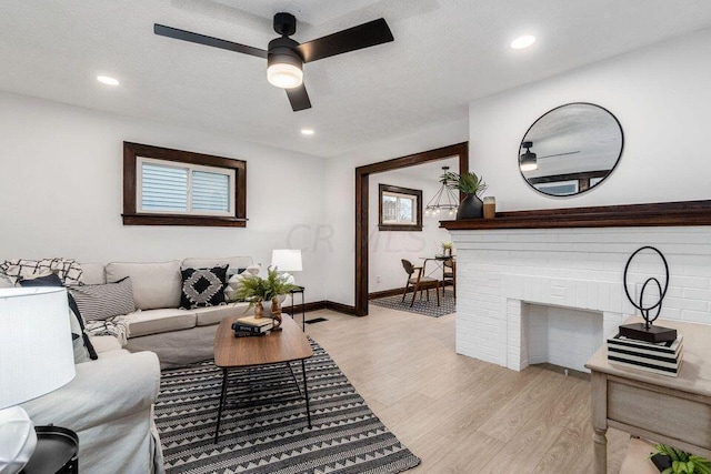 386 E Welch Ave, Columbus, OH 43207 - living room featuring light wood-style flooring, a ceiling fan, and recessed lighting