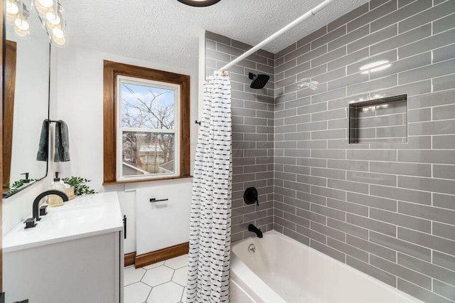 386 E Welch Ave, Columbus, OH 43207 - full bathroom featuring vanity, shower / tub combo, tile patterned flooring, and a textured ceiling