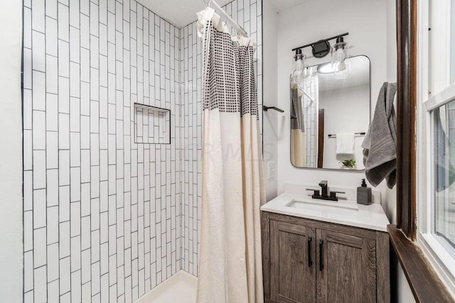 bathroom with a shower with shower curtain and vanity