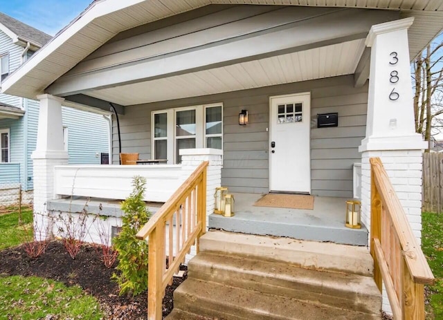 property entrance with covered porch