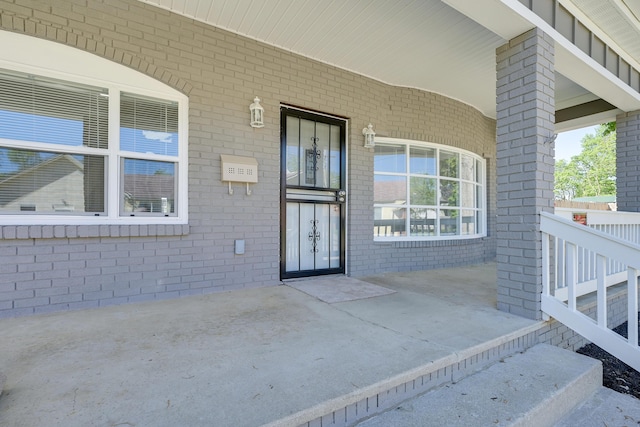 doorway to property with a porch