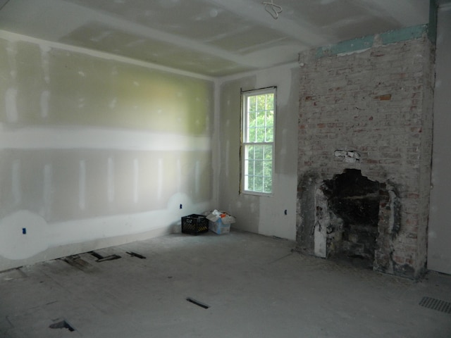 empty room featuring a fireplace