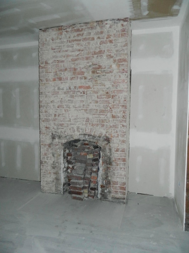 details featuring a fireplace and concrete floors