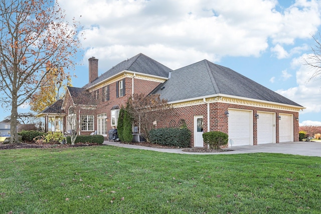 view of front of home with a garage and a front lawn