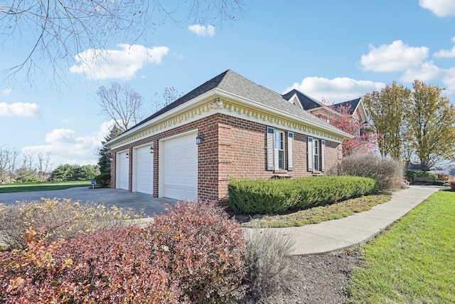 view of side of property with a garage