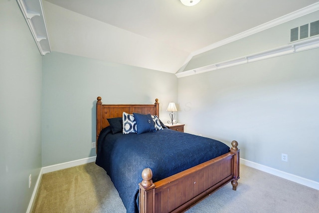 carpeted bedroom with lofted ceiling