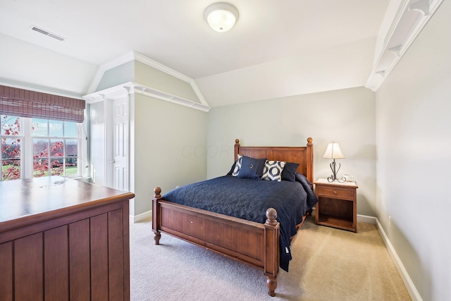 carpeted bedroom with lofted ceiling