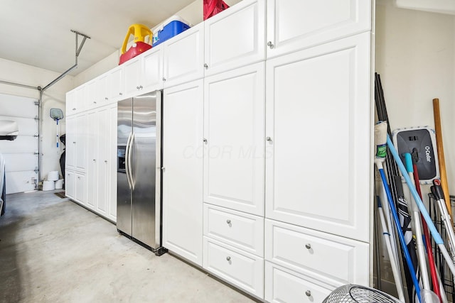 garage featuring stainless steel fridge