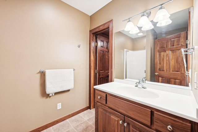 bathroom featuring tile patterned flooring and vanity