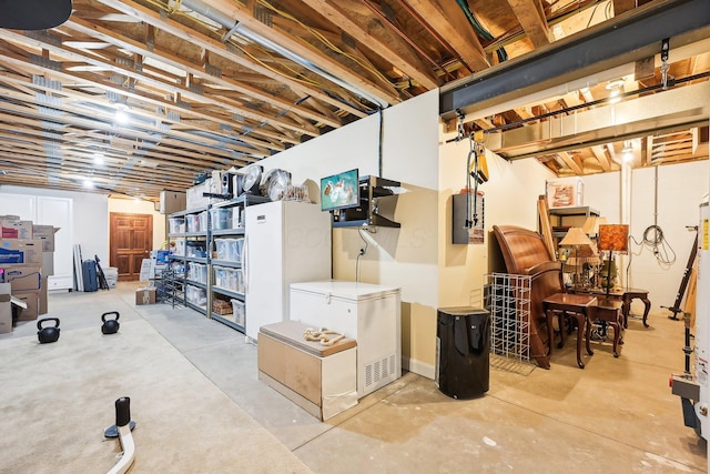 basement with refrigerator and electric panel