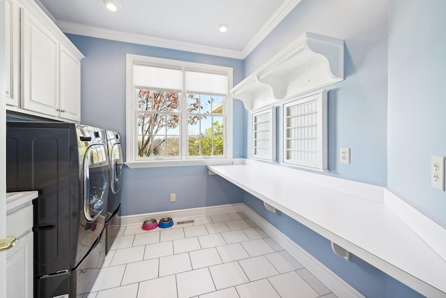 laundry room with light tile patterned flooring, cabinets, separate washer and dryer, and ornamental molding