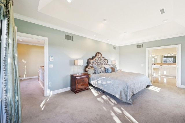 bedroom featuring carpet, ensuite bathroom, a raised ceiling, and crown molding