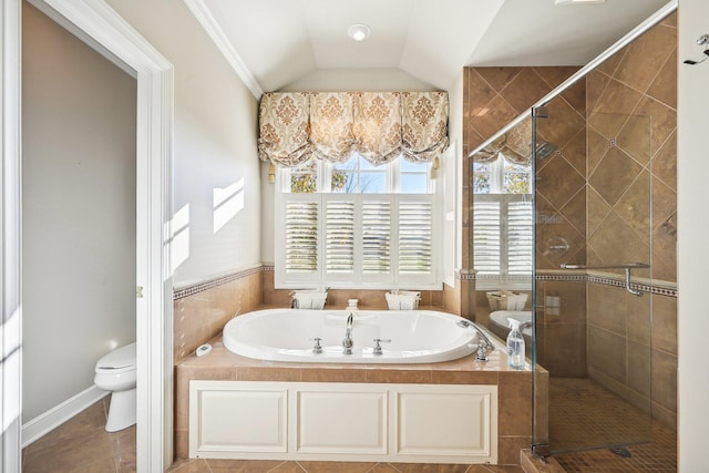 bathroom featuring tile patterned floors, ornamental molding, separate shower and tub, vaulted ceiling, and toilet