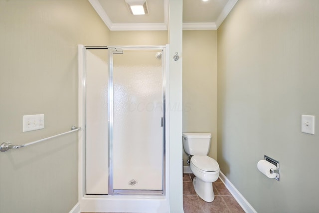 bathroom with toilet, tile patterned floors, a shower with shower door, and crown molding