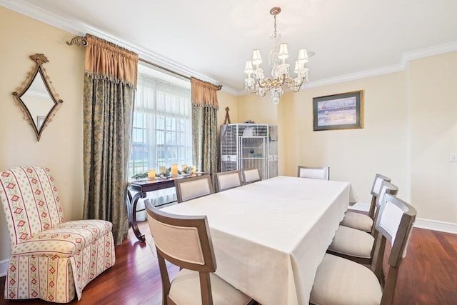 dining area featuring dark hardwood / wood-style flooring, a notable chandelier, and ornamental molding