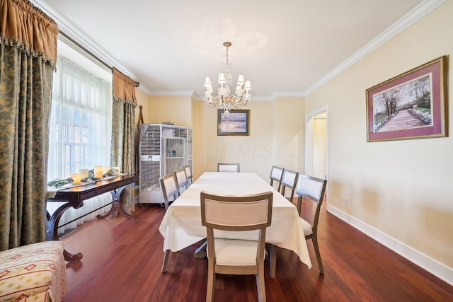 dining space with dark hardwood / wood-style flooring, crown molding, and a notable chandelier