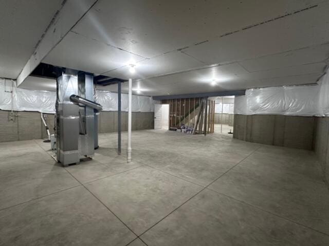 basement featuring heating unit